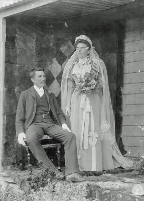 James and Beatrice marriage with wallaby skin rug bw
