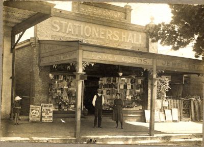 John Bembrick and shop assistant outside his Harden shop - 21 Feb 1921 (1)
