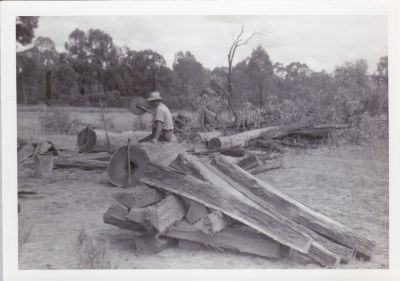 Ossie Southwell cutting wood
