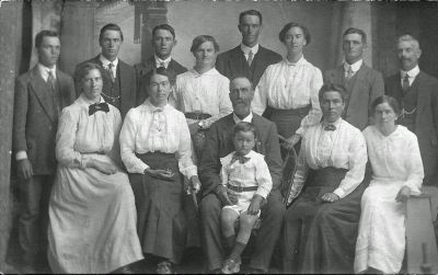 Smith Family - back - Keith, Cedric, Athol, Louie, Leon, Eunice, Hubert, Fred Newbury, and, Emily McFarlane, Elvena, Ellis and Colin, Rebecca and Muriel

